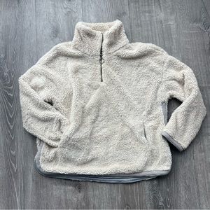 Cream colored 3/4 Zip Sherpa with silk interior